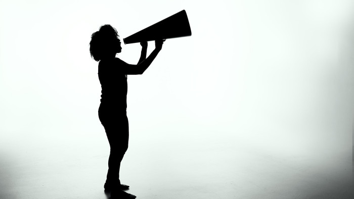 Silhouette of a person with a megaphone
