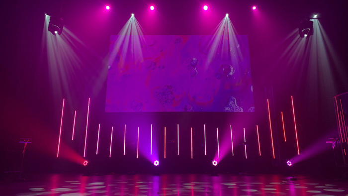 Stage of a dance floor with lots of festive lighting.