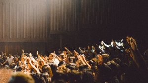 Group of people with their hands in the air.