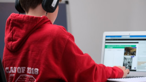 Boy searching information on a computer